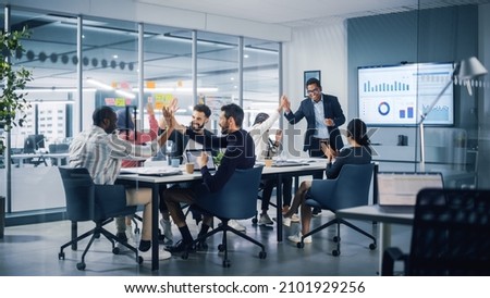 Multi-Ethnic Office Conference Room. Executive does Presentation for Young Managers. Team of Businesspeople Applaud, Celebrate Victorious Start of the Innovative e-Commerce Startup. Royalty-Free Stock Photo #2101929256