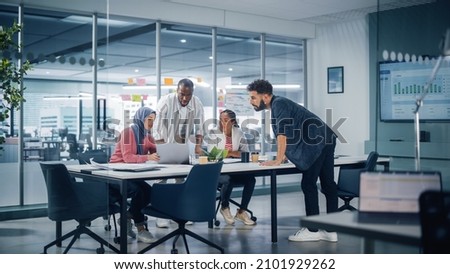 Multi-Ethnic Office Conference Room Meeting: Multicultural Team of Four Creative Entrepreneurs Talk, Discuss Growth Strategy. Diverse Young Businesspeople work on Digital e-Commerce Startup. Royalty-Free Stock Photo #2101929262