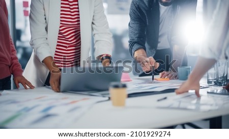 Multi-Ethnic Office Conference Room Businesspeople Meeting at Big Table. Diverse Team of Creative Entrepreneurs Talk, Find Solution. Specialists work in Digital e-Commerce Startup. Focus on Hands Royalty-Free Stock Photo #2101929274