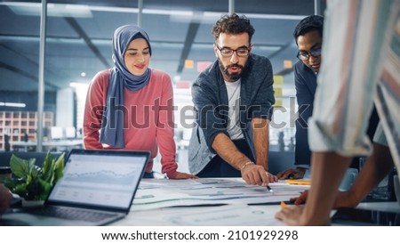 Multi-Ethnic Office Conference Room Businesspeople Meeting Gather Around Table. Diverse Team of Creative Professionals Talk, Brainstorms, work in Innovative Digital e-Commerce Startup. Royalty-Free Stock Photo #2101929298