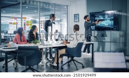 Modern Multi-Ethnic Architectural Agency Office Meeting. Group of Professional Architects, Designers, Developers, Investors Use TV with 3D Building Model to Design Sustainable Housing Project