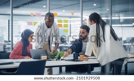 Office Conference Room Meeting: Diverse Team of Young Investors, Workers, Developers work on Creative e-Commerce Digital Startup. Group of Multi-Ethnic Business Professionals work on Product Strategy