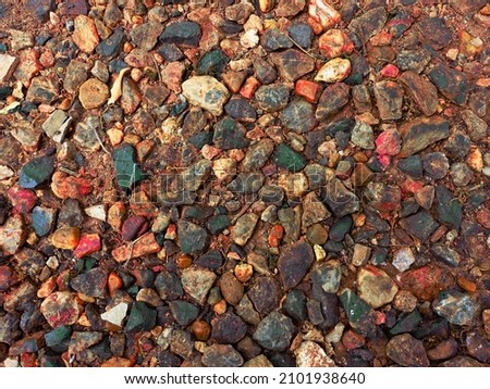 stone pile floor look red and wet because rubber tree