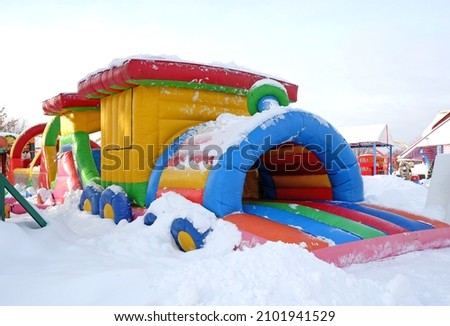 inflatable trampoline in winter in an amusement park