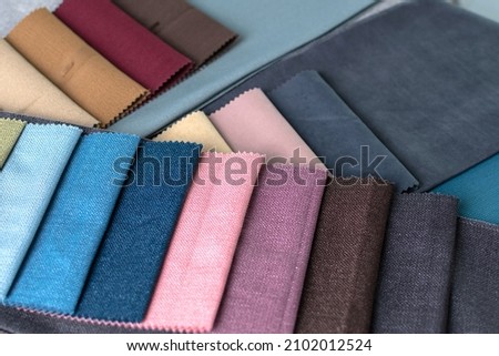 Samples of fabrics in different tones. The choice of fabrics for interior decoration. Palette