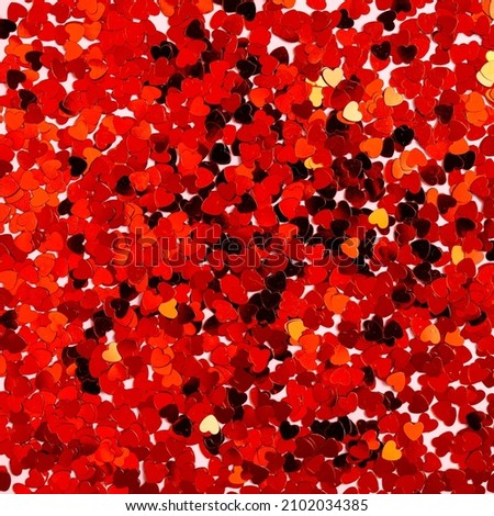 Red confetti shape of hearts pattern. Abstract Valentines day background.