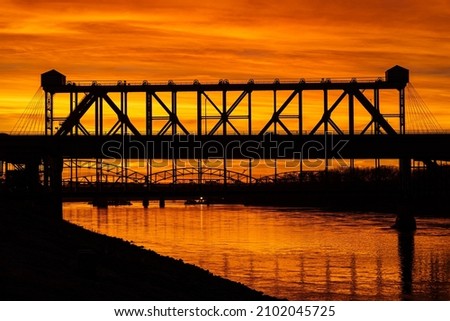 A bridge over the Missouri River at Berkley park on the sunset Royalty-Free Stock Photo #2102045725