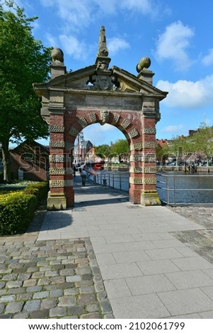 The historic harbor gate at Ratsdelft, Emden, East Frisia, Lower Saxony, Germany Royalty-Free Stock Photo #2102061799