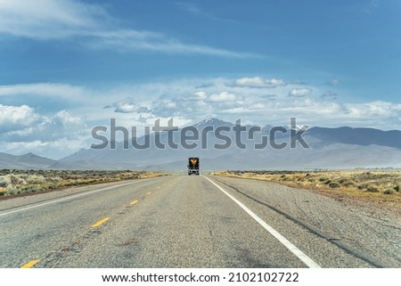 A beautiful Commercial truck on HWY 95 NB in Nevada, USA Royalty-Free Stock Photo #2102102722