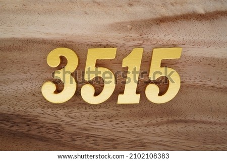 Golden Arabic numerals 3515 on a dark brown to white wood grain background.