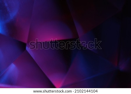 Blurred triangle background abstract. Dark color triangel backdorp.