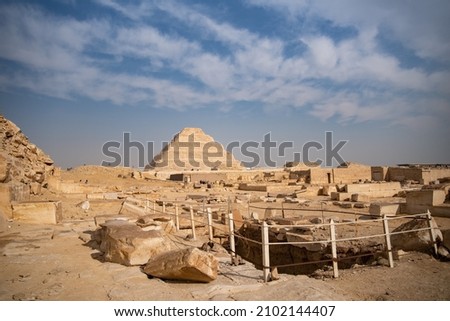 View to Step pyramid of Djoser in Saqqara from pyramid of Unas, an archeological remain in the Saqqara necropolis, Egypt Royalty-Free Stock Photo #2102144407