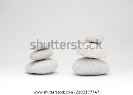Stacks of Pebbles stones balance on white background