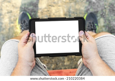 Man with tablet in park or outdoor