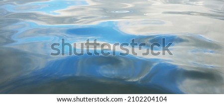Sea water surface, close-up. Still water. Abstract natural pattern, texture, background, wallpaper. Concept image, macro photography, graphic resources. Blue color. Gulf of Finland, Hanko Peninsula