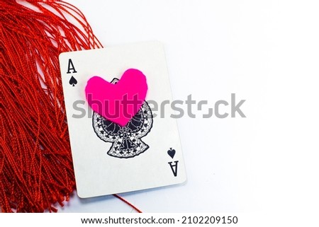 ace of spades with pink heart symbol on an isolated white background. South Kalimantan, Indonesia. January 6, 2022. 
