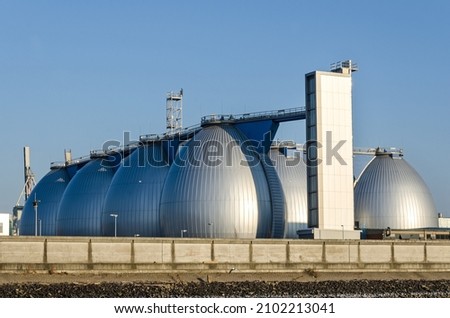Gas storage tanks in the harbour area in Hamburg, Germany  Royalty-Free Stock Photo #2102213041