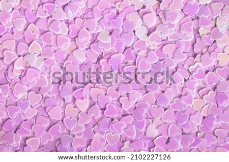 Sparkle confetti hearts purple texture. Valentines day background. Top view, flat lay