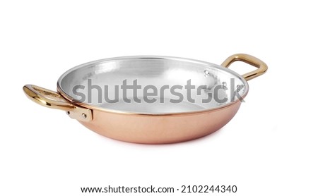 Copper pan with handles, isolated on white background Royalty-Free Stock Photo #2102244340