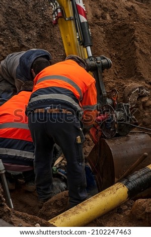 Workers attending to the city water supply repairs.