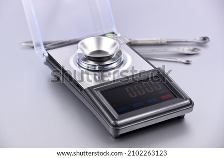 Precision Digital Jewelry Scale stock images. Portable modern mini pocket scale on a silver background stock photo Royalty-Free Stock Photo #2102263123