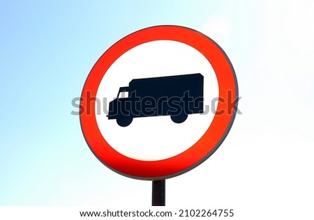 Road sign B-5 no entry for trucks against the sky