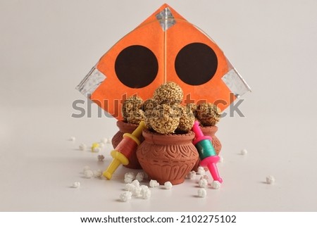 Firki and tilgul for makar sankranti. Makar sankranti is Indian kite Festival. It is also known as uttarayan. Firki is also called spin or Patang dori. Royalty-Free Stock Photo #2102275102