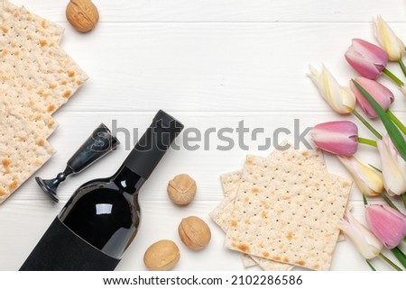 Flat lay composition with matzos on color background. Top view. Passover (Pesach) festive Royalty-Free Stock Photo #2102286586