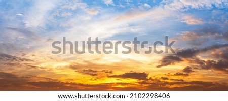 Panoramic view of blue sky and cloudy orange sunlight, natural phenomena background