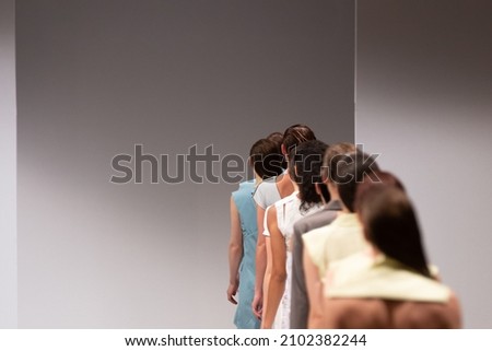 Fashion models at a catwalk during a fashion show 