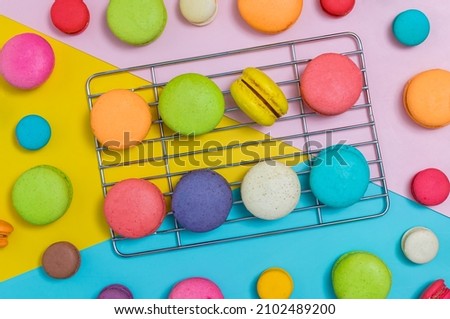 Colorful macaroons variety. colorful macarons dessert with vintage pastel tone. Sweet colorful macaroons on color background