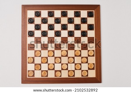 Draughts 10x10, checker board, wood design Royalty-Free Stock Photo #2102532892
