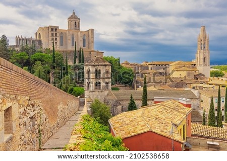 View from the protective wall on the medieval city of Girona with the Cathedral of St. Maria and the Church of St. Feliu. Girona, Catalonia, Spain. 