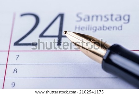 a ink pen on a calendar at Chrismas