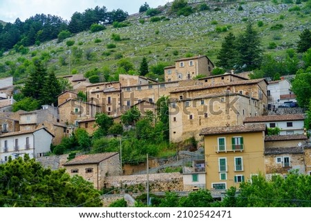 Mountain landscape at Gran Sasso Natural Park, in Abruzzo, Italy, L Aquila province, at springtime (June). View of Calascio, historic village