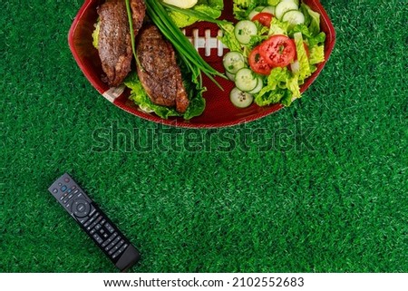Party food plate for celebrate and watching american football game. Top view. Royalty-Free Stock Photo #2102552683