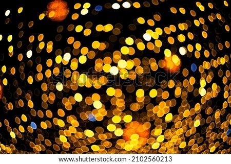 Christmas background. Defocused lights from garlands. Abstract texture.