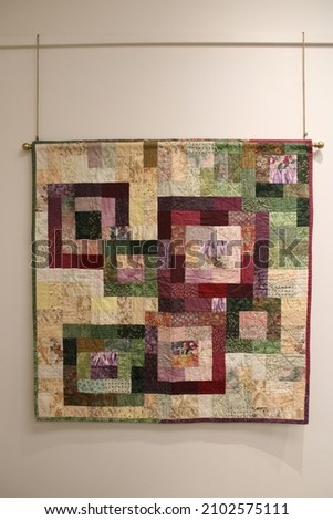 Handmade quilt with beautiful colors and designs. It took years of sewing and experiments with shapes and patterns and a lot of hard work. Quilt created by Carolyn Liebler.