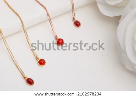 Carnelian necklaces on white background. Necklace image for e commerce, social media.