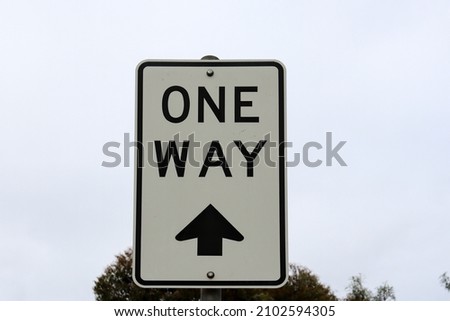 one way sign against sky