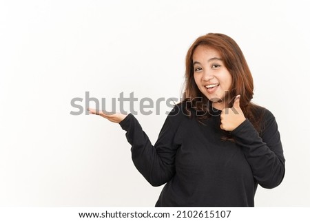 Showing recommended product on open palm Of Beautiful Asian Woman Wearing Black Shirt Isolated On White Background