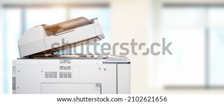 Copier printer, Close up the photocopier or photocopy machine office equipment workplace for scanner or scanning document and printing or copy paper and xerox. Royalty-Free Stock Photo #2102621656