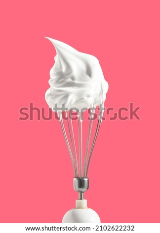 Whipped cream on the top of kitchen mixer. Process of making confectionery masterpiece. Sweet mood and aesthetics of cooking. Royalty-Free Stock Photo #2102622232