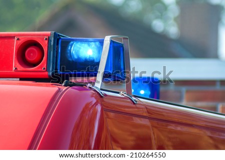 close-up picture of blue lights and sirens on a fire-truck