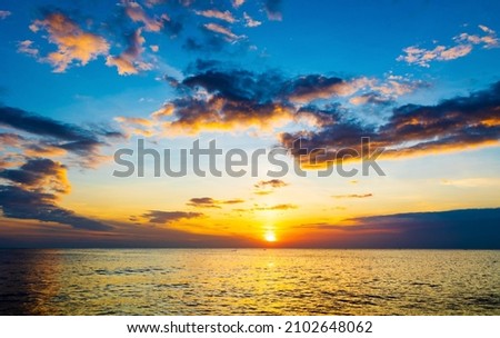 Stunning view of sunset with beautiful clouds and colorful sky in the evening. Captured from the coast of Kanyakumari Tamil Nadu India.