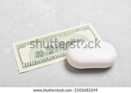 A bill under a bar of soap. Money laundering. Corruption and bribery. A bill under a bar of soap.