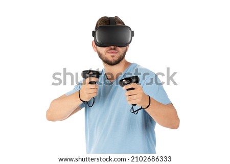 Close up of young man playing with a VR glasses on a white background