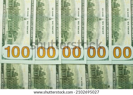 Hundred dollar bills folded up so it's ten billion Royalty-Free Stock Photo #2102695027