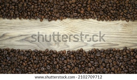 pile of coffee beans on a wooden table