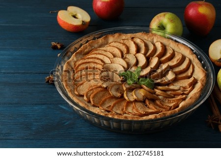 Concept of tasty food with apple pie on wooden background